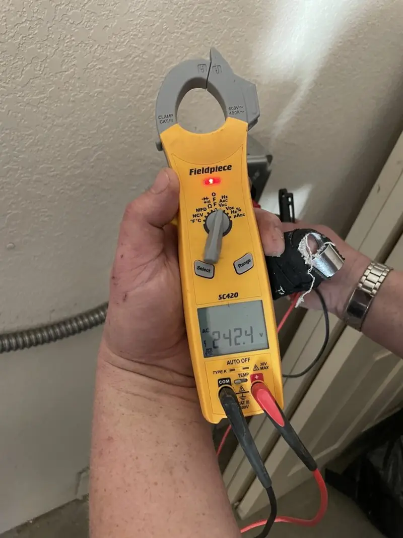 Voltage testing with clamp meter during Generator Installation in Warren